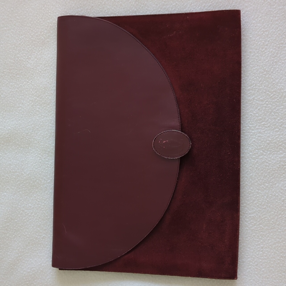 Cartier Must de Cartier suede and leather clutch.